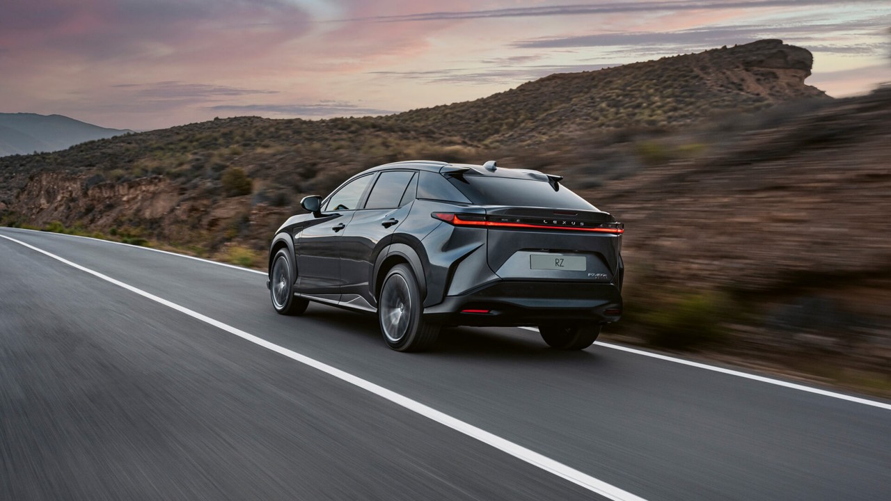 Rear view of the Lexus RZ driving