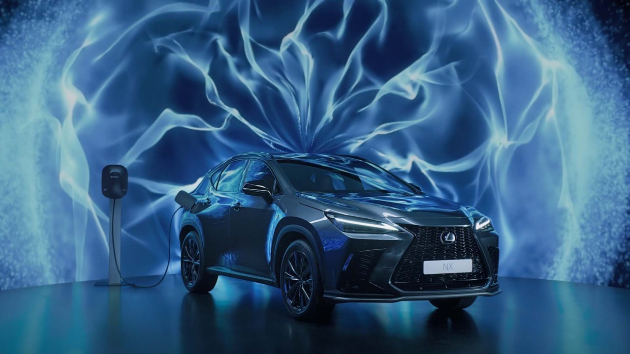 Lexus NX plugged into a charging tower